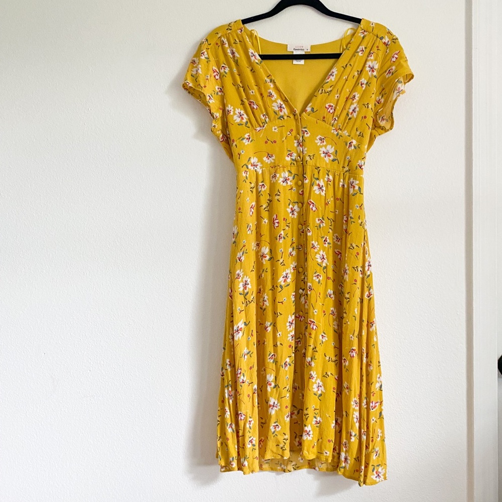 Mustard color dress with a floral pattern
